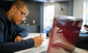 Student taking notes