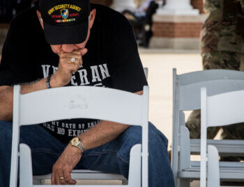 Veteran sits in silence at a memorial service