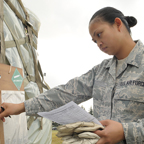 Female military student looking through papers